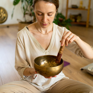 Woman playing Tibetan Singing Bowl